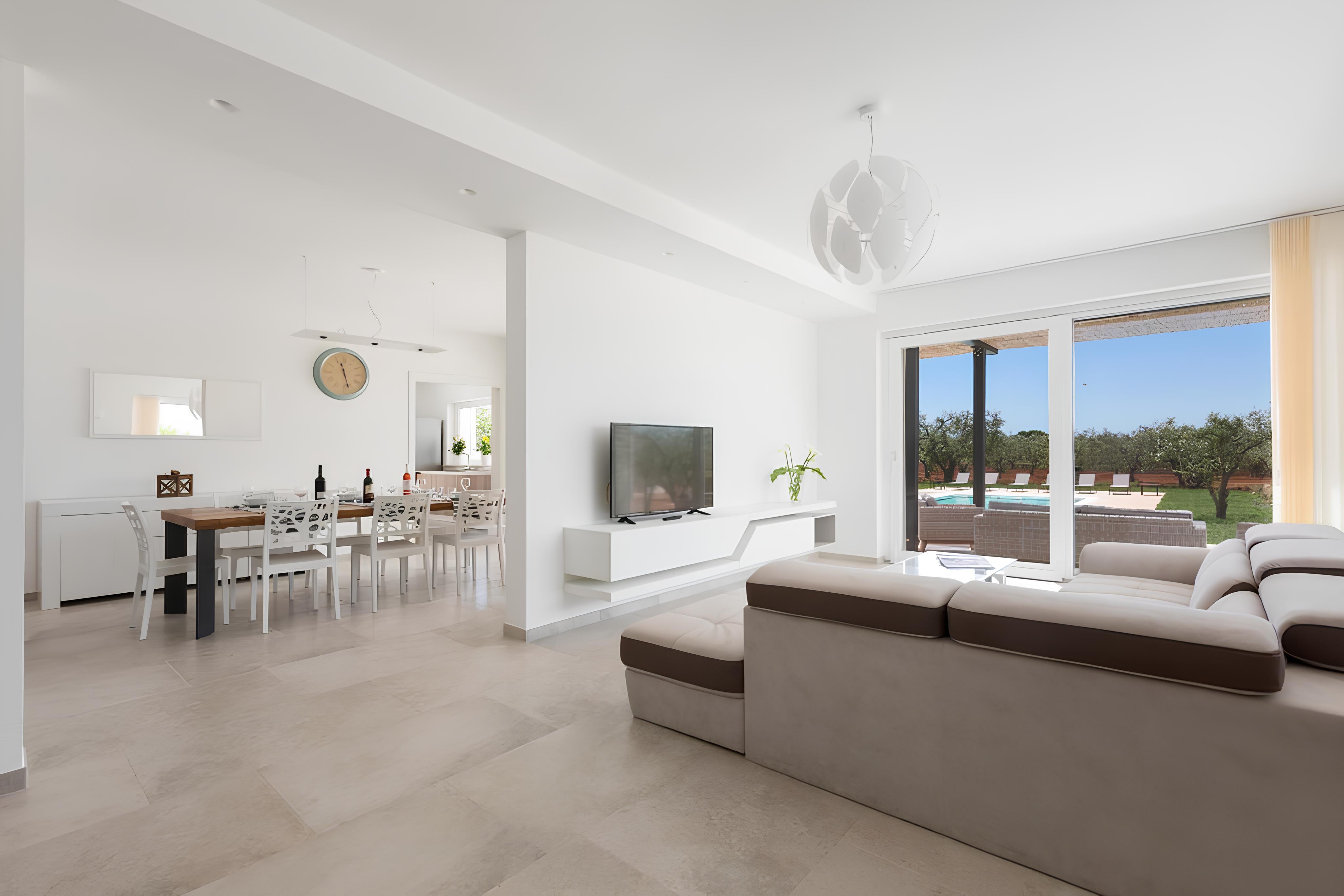 Living room opening onto the terrace and pool